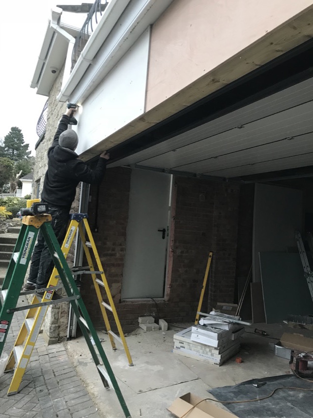 Garage door fitting